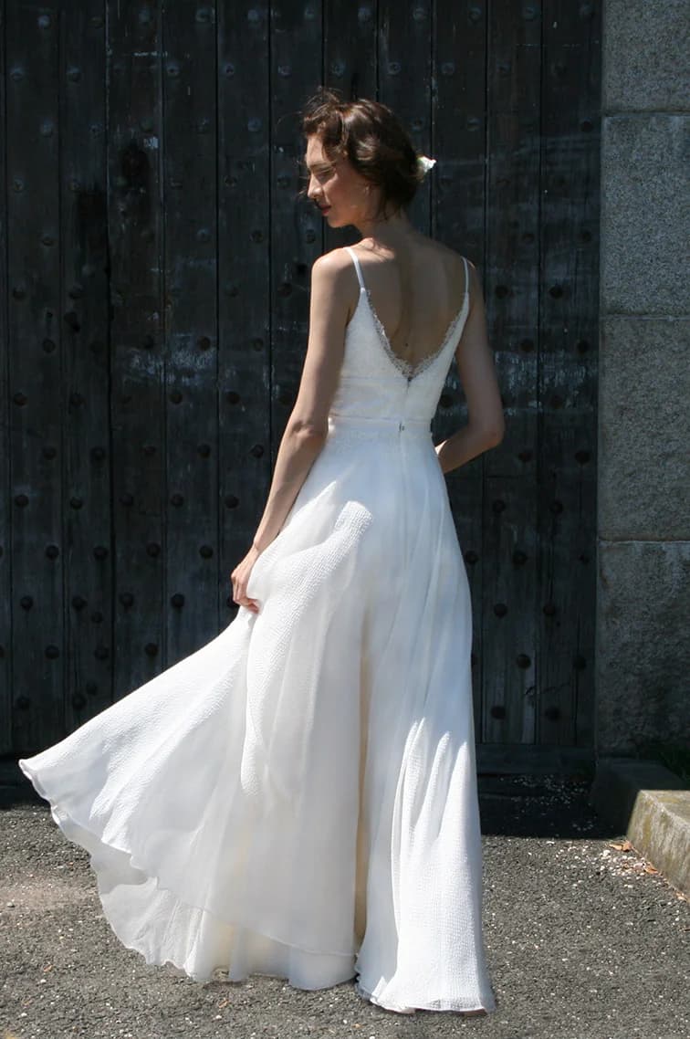 Bride wearing a flowing Nazarela gown on a New York street