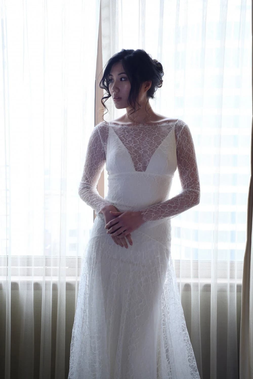 Bride wearing a layered Nazarela gown on a New York street